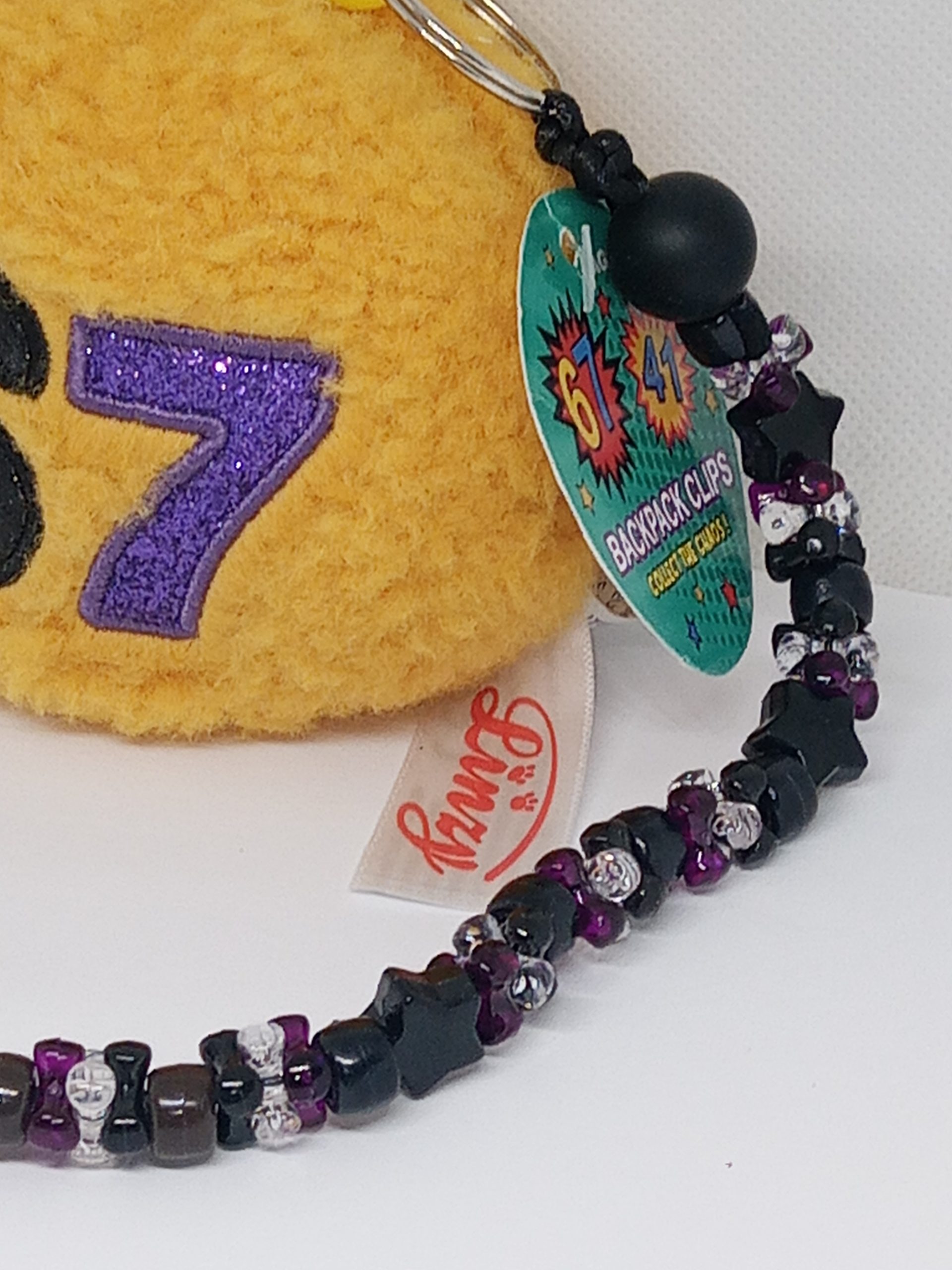 Handmade beaded dangle attached to plush keychain
