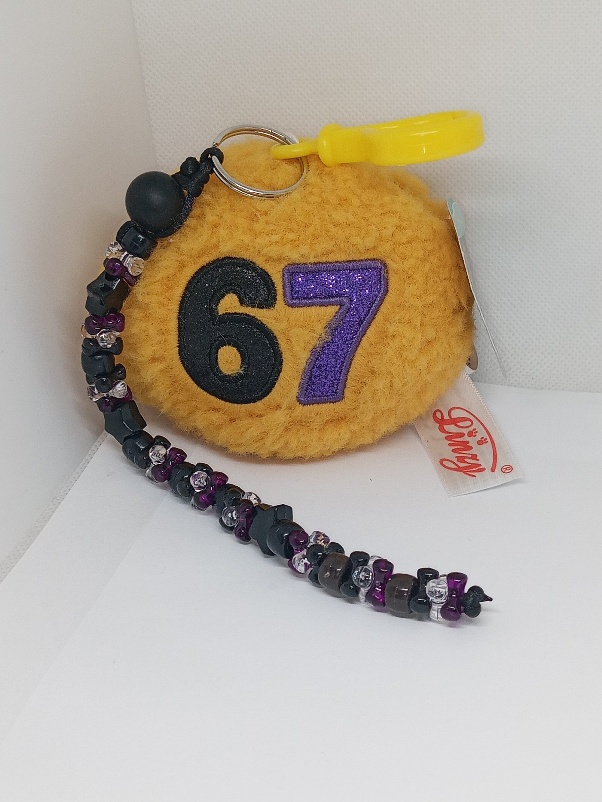 Lucky Number 67 plush backpack clip with handmade black purple and clear beaded dangle