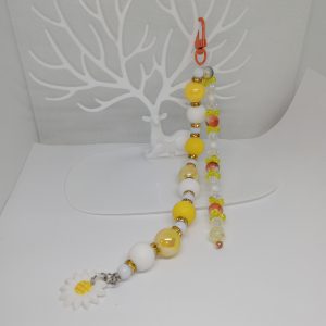 Full-length yellow beaded bag charm with decorative double strand
