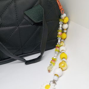 Yellow beaded purse charm with daisy and gold-tone accents